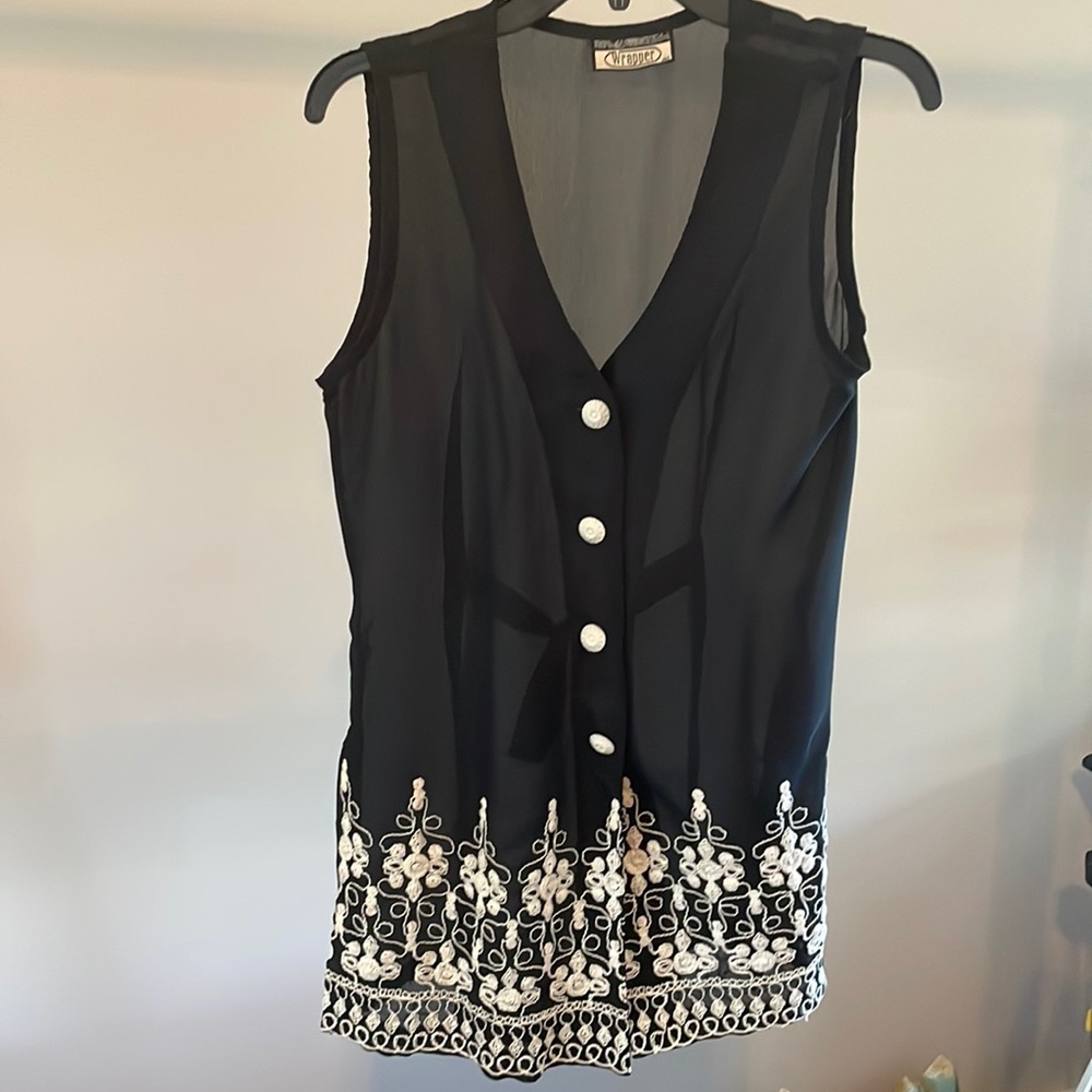 See-through vest. Beautiful diaphanous black vest with detailed embroidery.